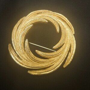 MONET GOLDTONE SWIRL BROOCH, VINTAGE